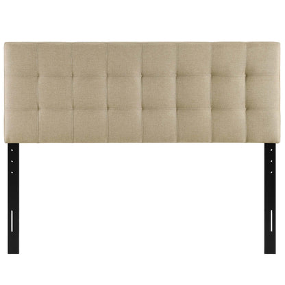 Beige tufted fabric headboard with square grid panels on black metal legs.