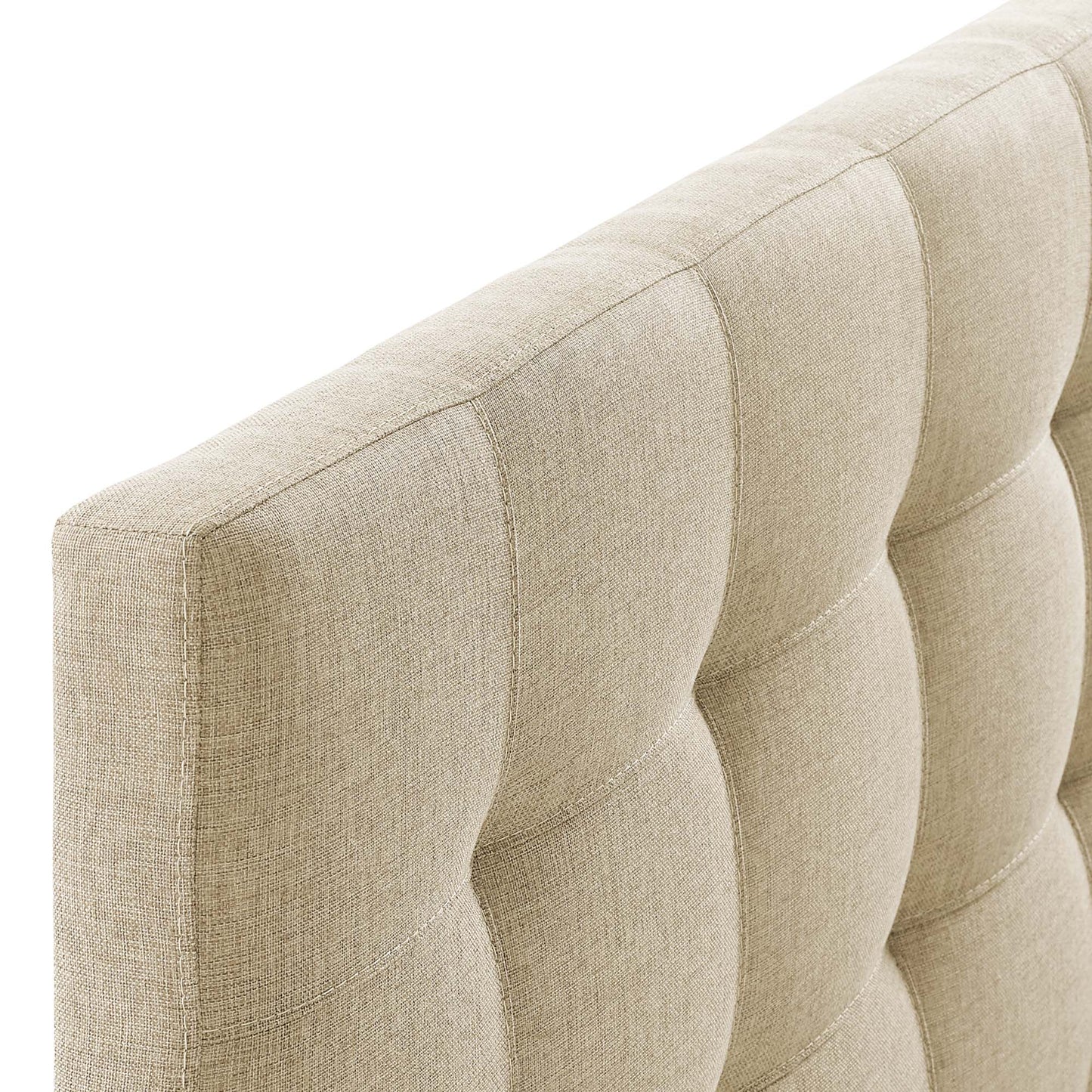 Beige tufted fabric headboard with square tufting and textured upholstery.