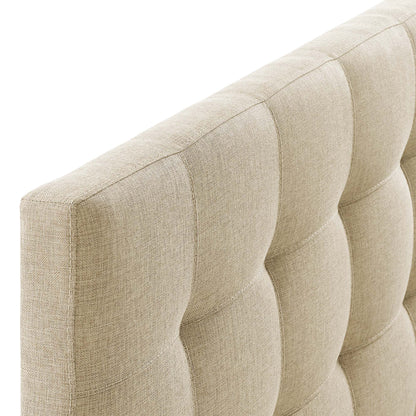 Beige tufted fabric headboard with square tufting and textured upholstery.