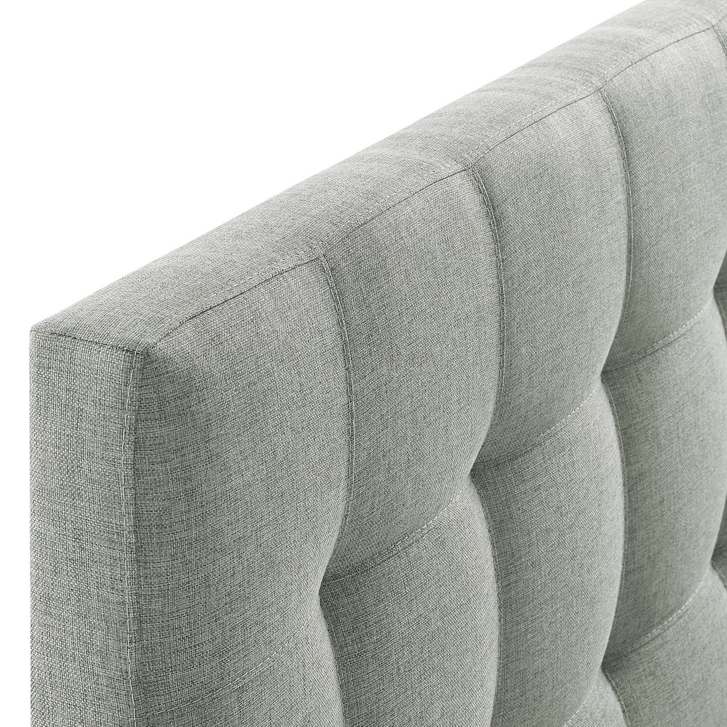 Gray fabric upholstered full headboard with vertical channel seams.