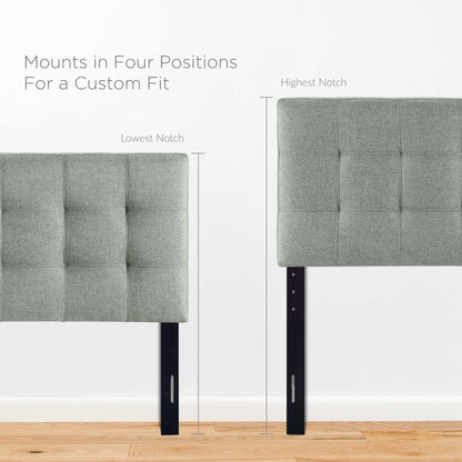 Gray tufted upholstered full headboard.