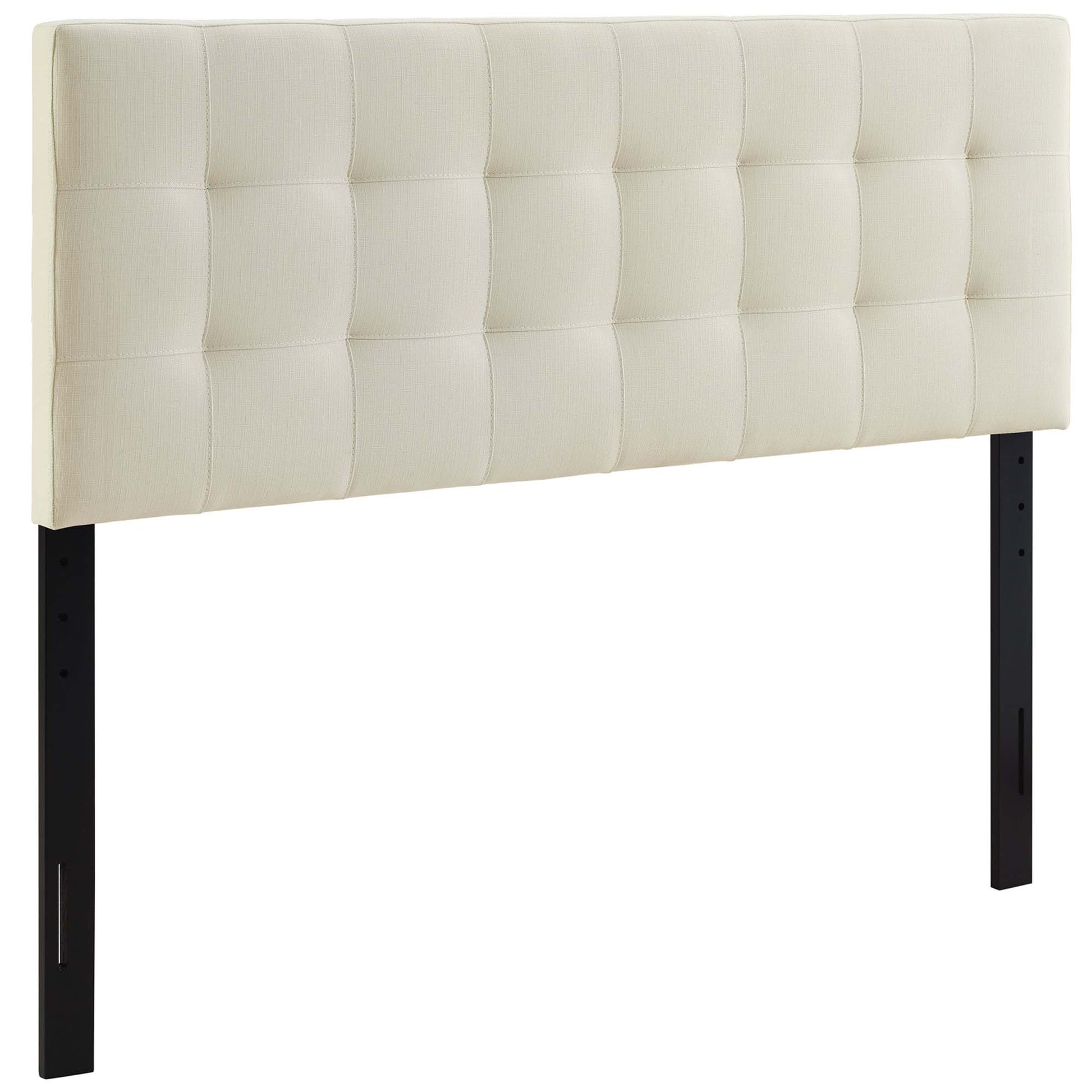White tufted upholstered headboard with square quilted panels on black metal legs.