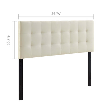 White tufted upholstered headboard with a square grid pattern, supported by metal legs.