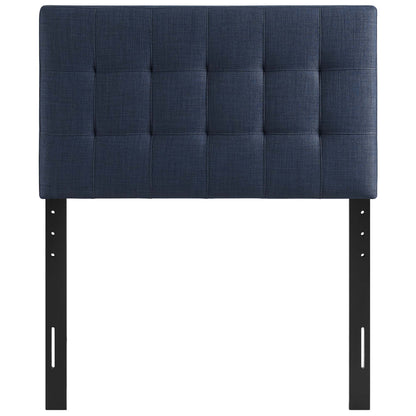 Navy blue tufted fabric headboard with grid quilting, mounted on black metal legs for bed frame.
