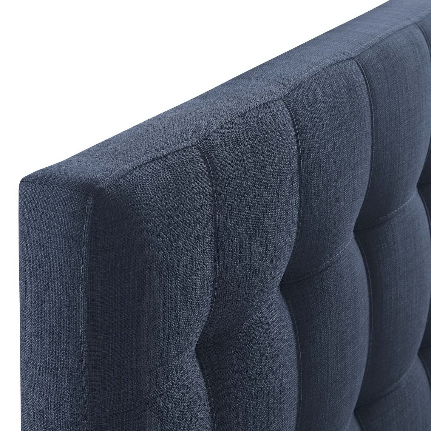 Navy blue upholstered twin headboard with vertical channel tufting and square panels.
