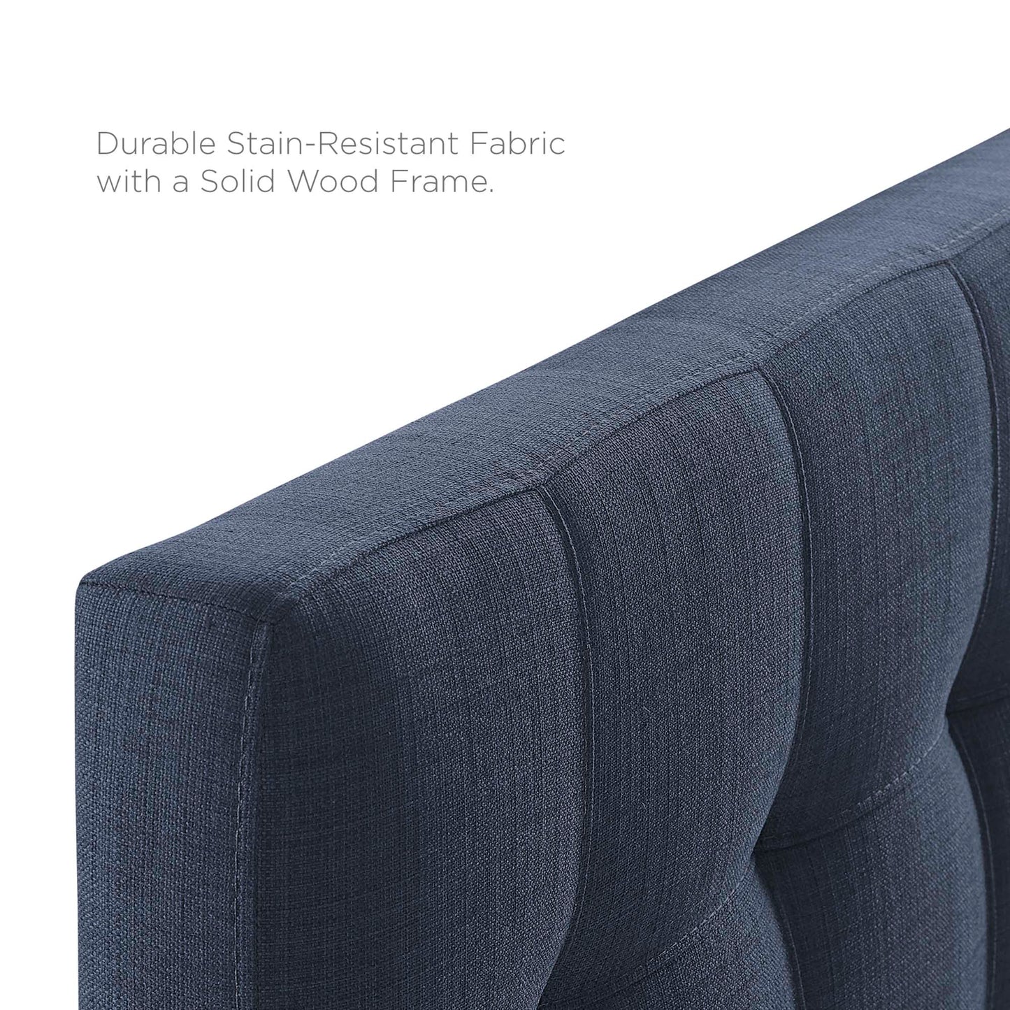Navy blue upholstered fabric twin headboard with vertical channel tufting and solid wood frame.