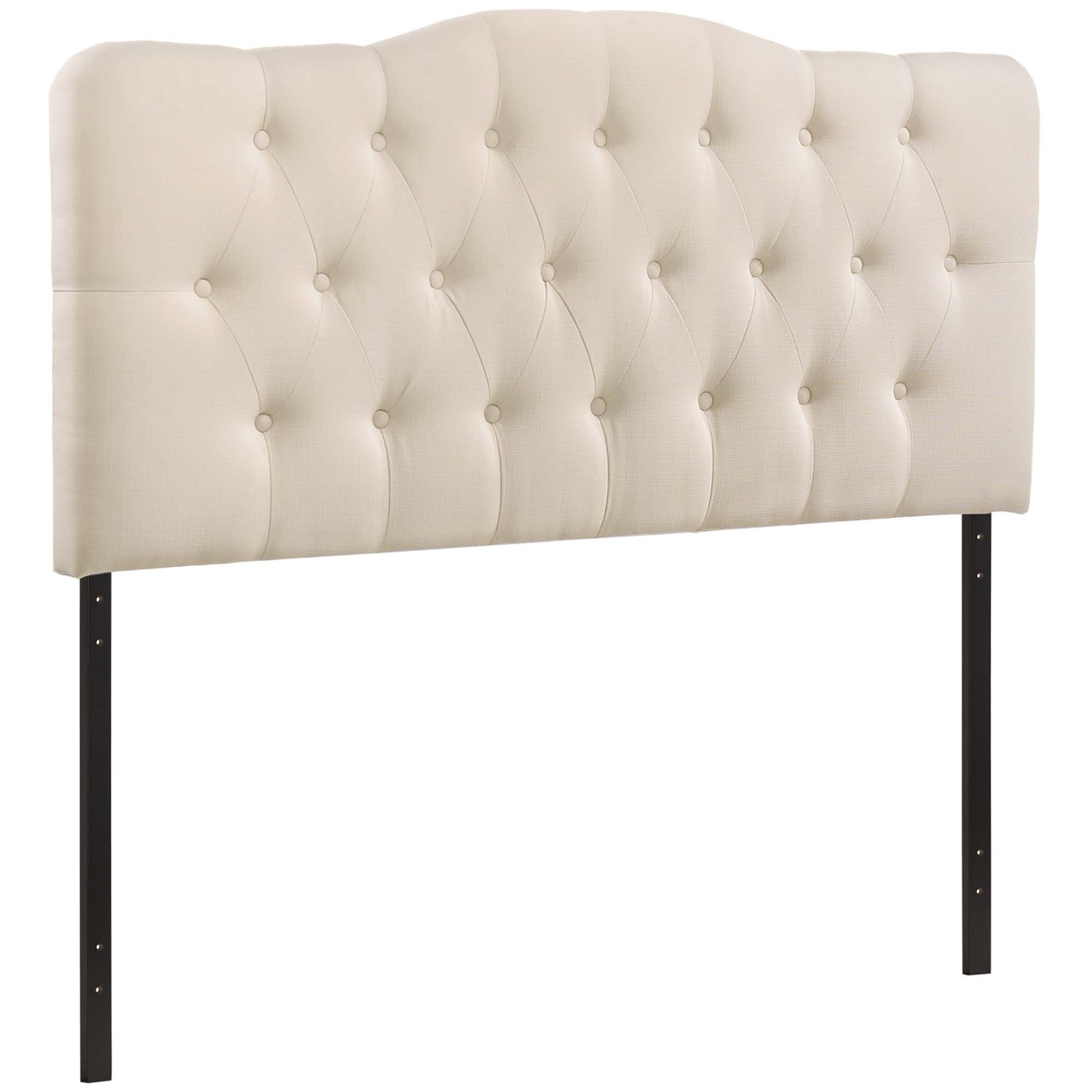 Ivory upholstered tufted headboard with button detailing, curved top, supported by black metal legs.