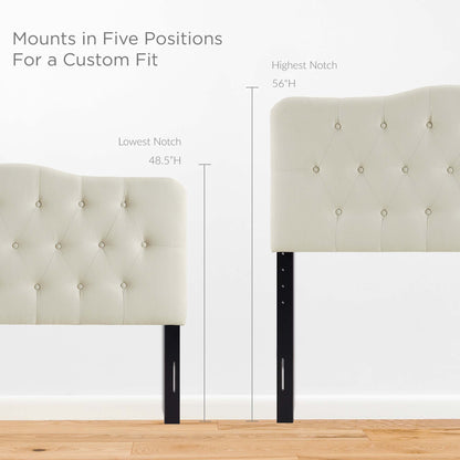 White tufted upholstered headboard with black legs; mounts in five height positions for a custom fit.