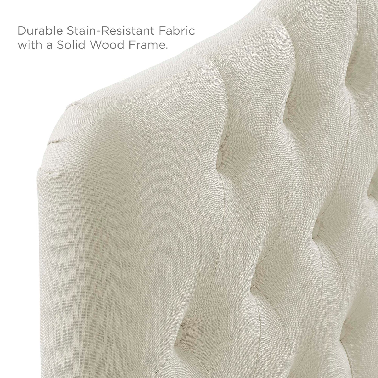 Ivory tufted fabric upholstered headboard with button tufting & a solid wood frame.