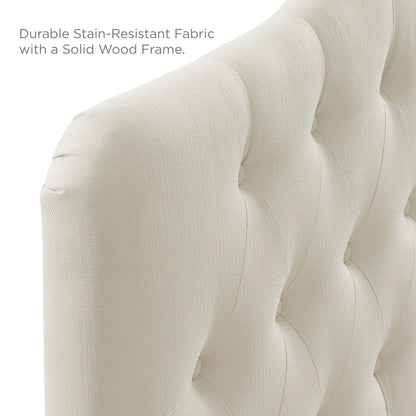 Ivory tufted fabric upholstered headboard with button tufting & a solid wood frame.