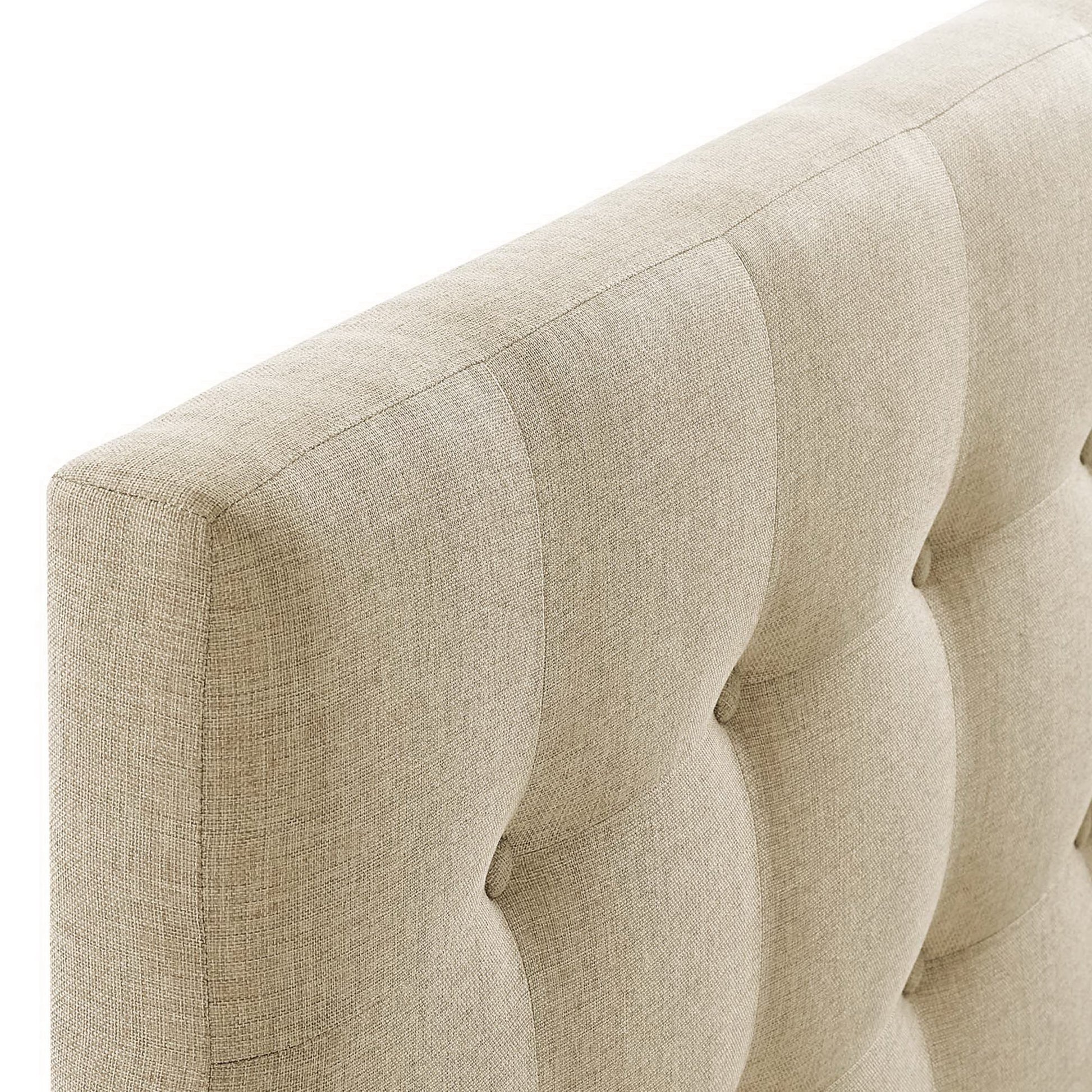 Beige upholstered fabric queen headboard with vertical channel tufting; close-up of texture.