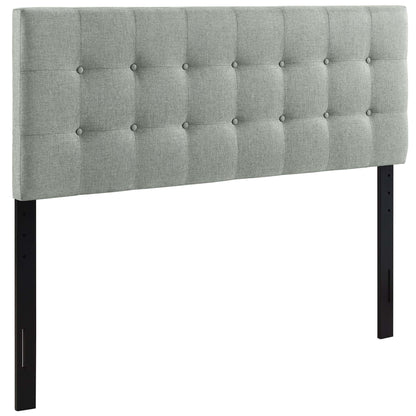 Gray tufted fabric queen headboard with button details and black rectangular legs.