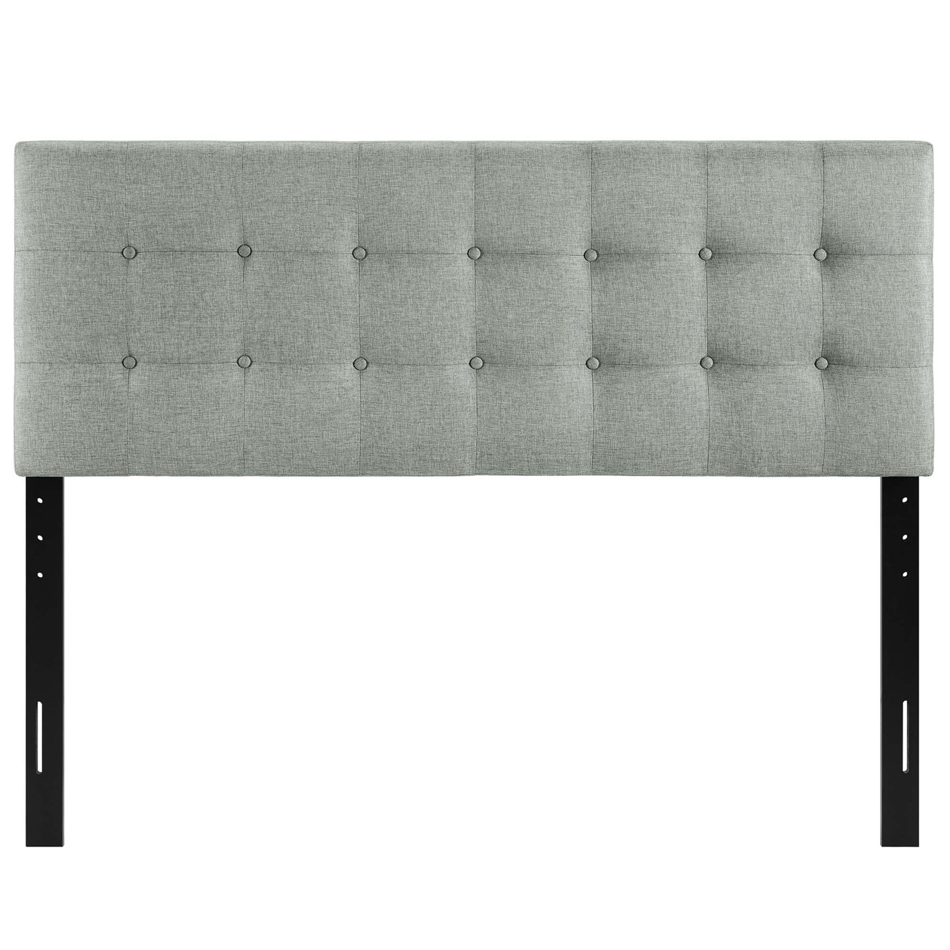 Grey tufted upholstered headboard with square button details, mounted on black metal legs for a modern bed frame.