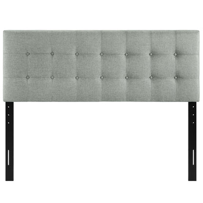 Grey tufted upholstered headboard with square button details, mounted on black metal legs for a modern bed frame.