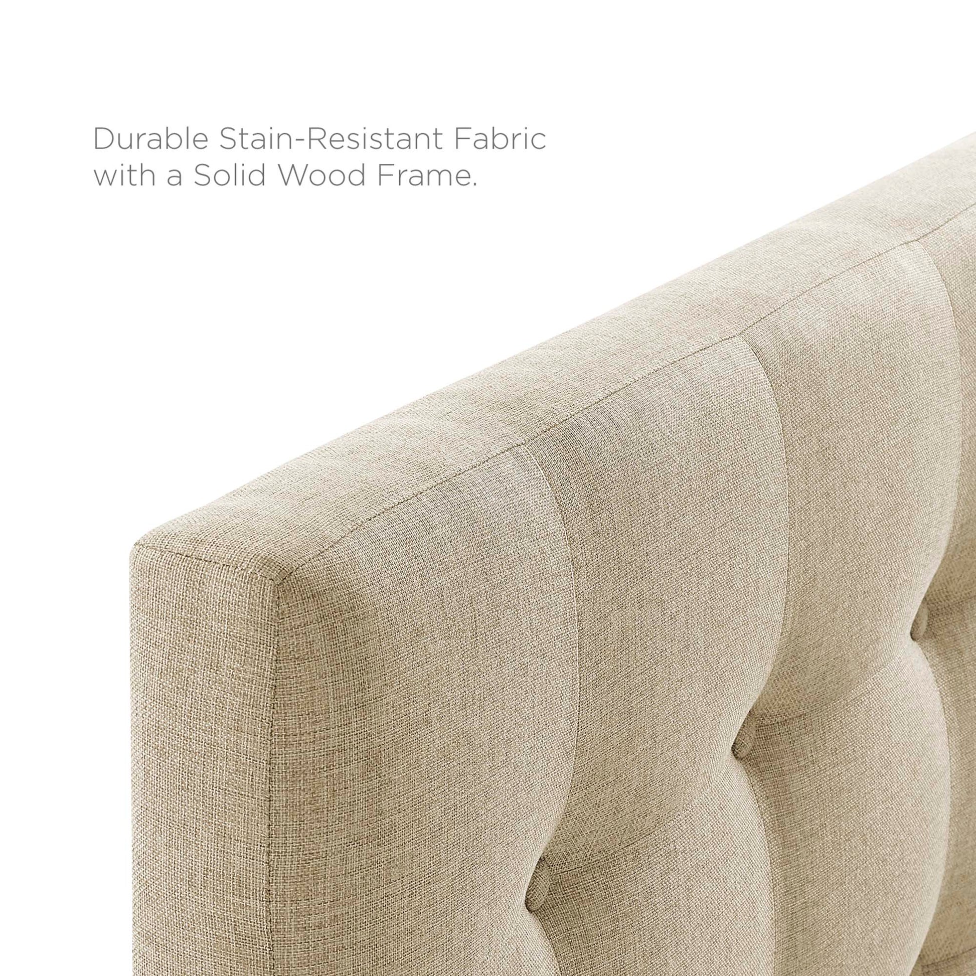 Beige upholstered fabric king headboard for a bedroom.