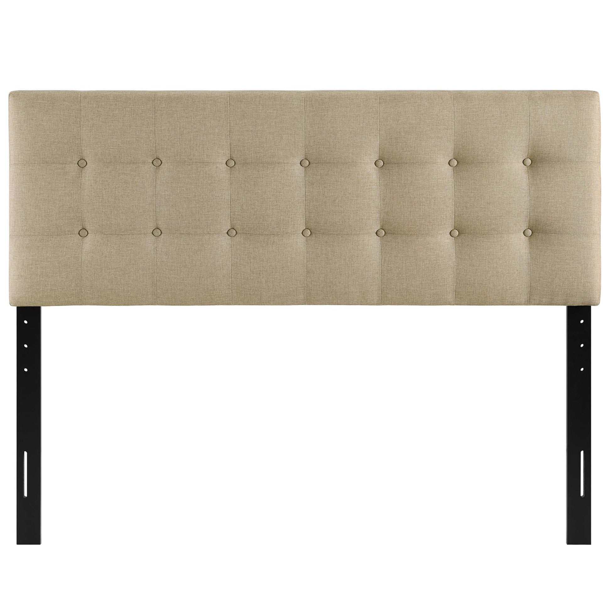 Beige upholstered tufted king headboard with square button-tufting and black metal legs.