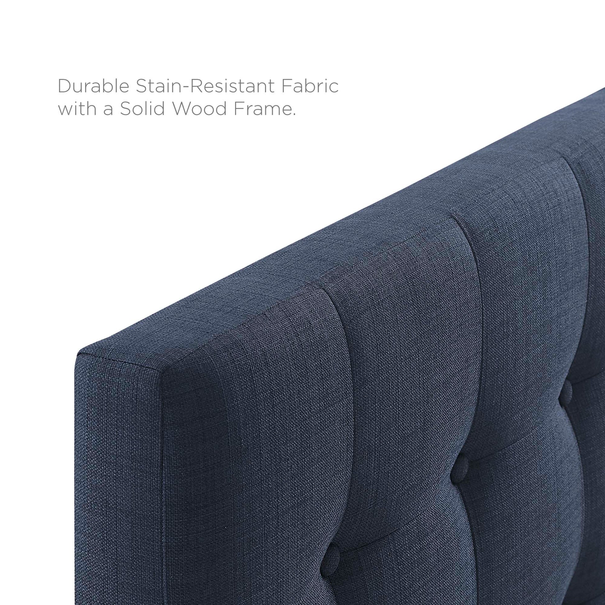 Navy blue tufted upholstered king headboard with button accents for a bed in the bedroom.