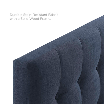 Navy blue tufted upholstered king headboard with button accents for a bed in the bedroom.