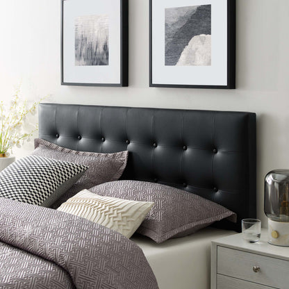 Black tufted vinyl king headboard with button details.