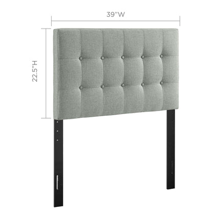 Gray tufted fabric headboard with square button-tufting and black metal legs; 39W x 22.5H.