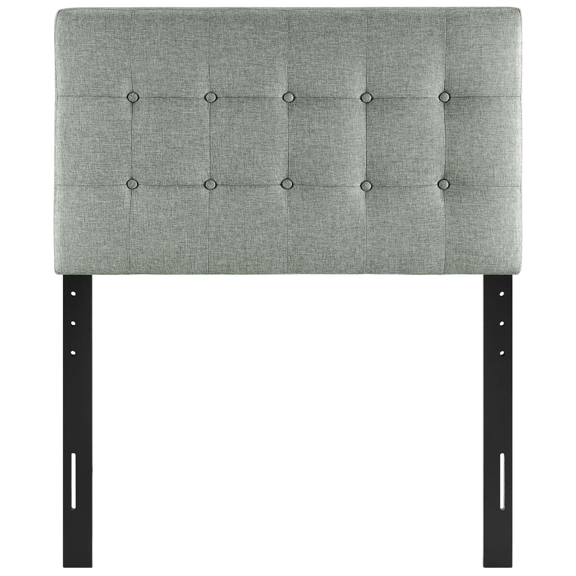 Gray tufted fabric headboard with square button tufting on black metal adjustable legs—modern headboard