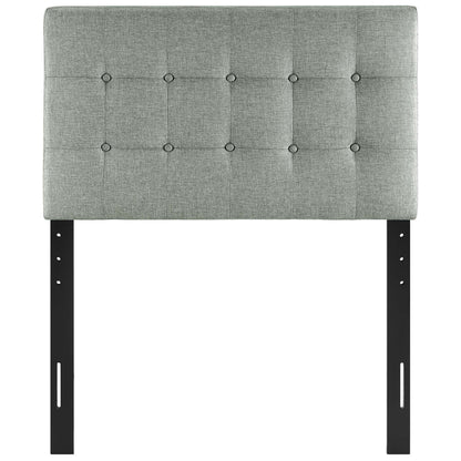 Gray tufted fabric headboard with square button tufting on black metal adjustable legs—modern headboard