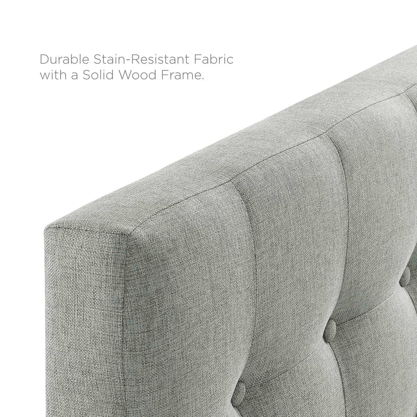 Gray tufted fabric twin headboard with a solid wood frame.