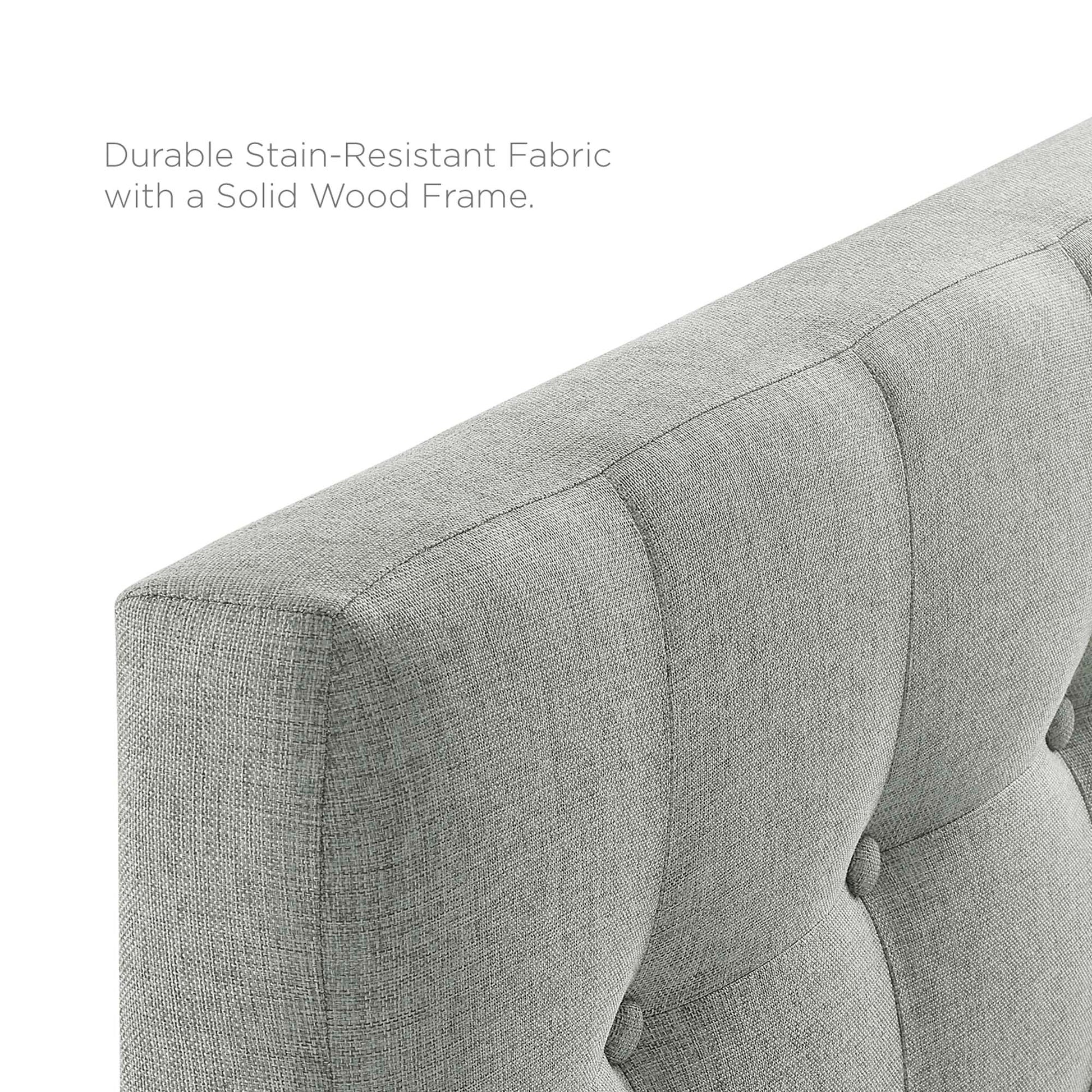 Gray tufted fabric twin headboard with a solid wood frame.