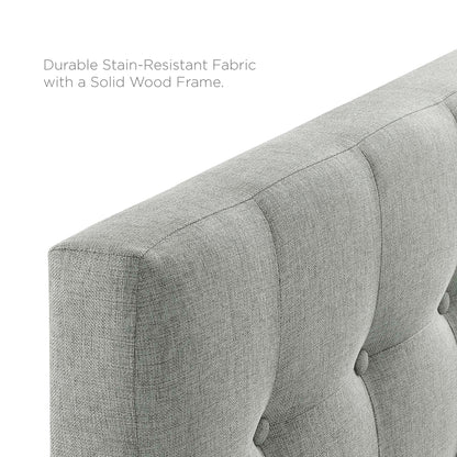 Gray tufted fabric twin headboard with a solid wood frame.