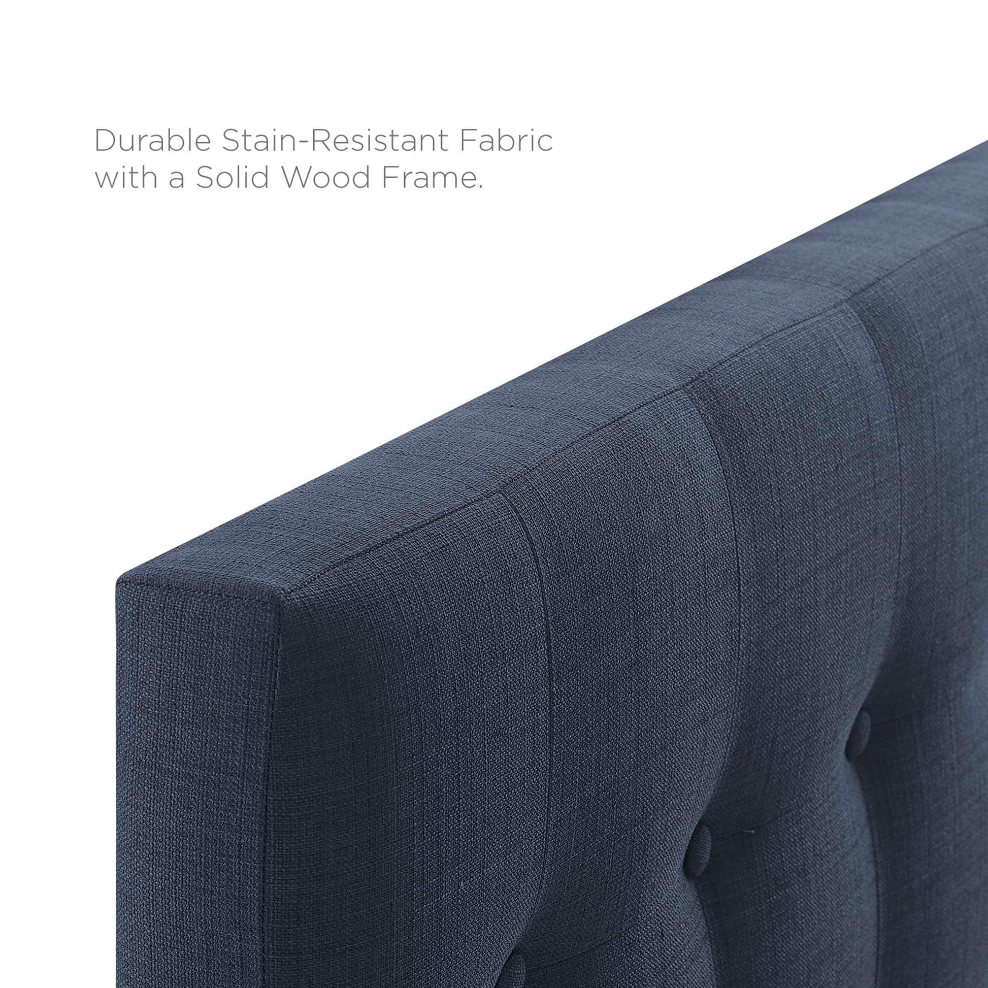 Navy blue tufted fabric twin headboard with channel stitching and button accents; wood frame.