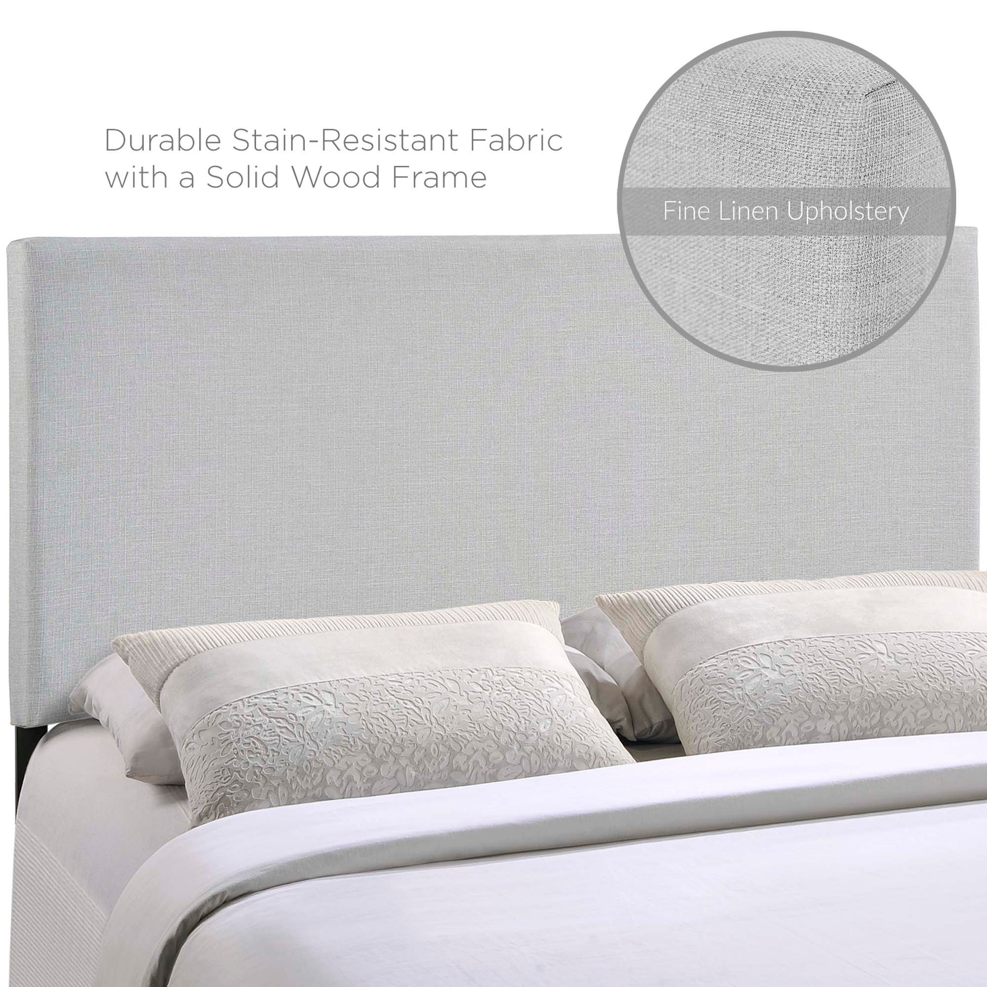 Gray upholstered headboard with a solid wood frame, linen-like fabric, textured decorative pillows, and white bedding.