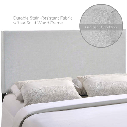 Gray upholstered headboard with a solid wood frame, linen-like fabric, textured decorative pillows, and white bedding.
