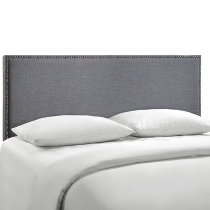 Black fabric upholstered queen headboard with nailhead trim above white bedding and pillows on a modern bed.