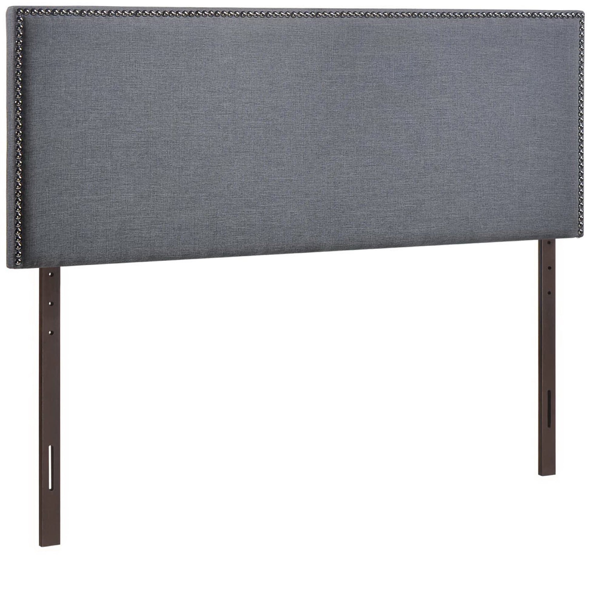 Black fabric upholstered queen headboard with nailhead border and dark wood legs.