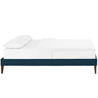Azure fabric full bed frame with squared tapered legs, white bedding, modern minimalist style.