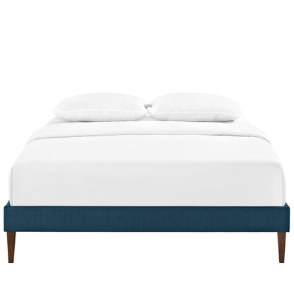 Azure fabric full bed frame with squared tapered legs, white bedding and two pillows.