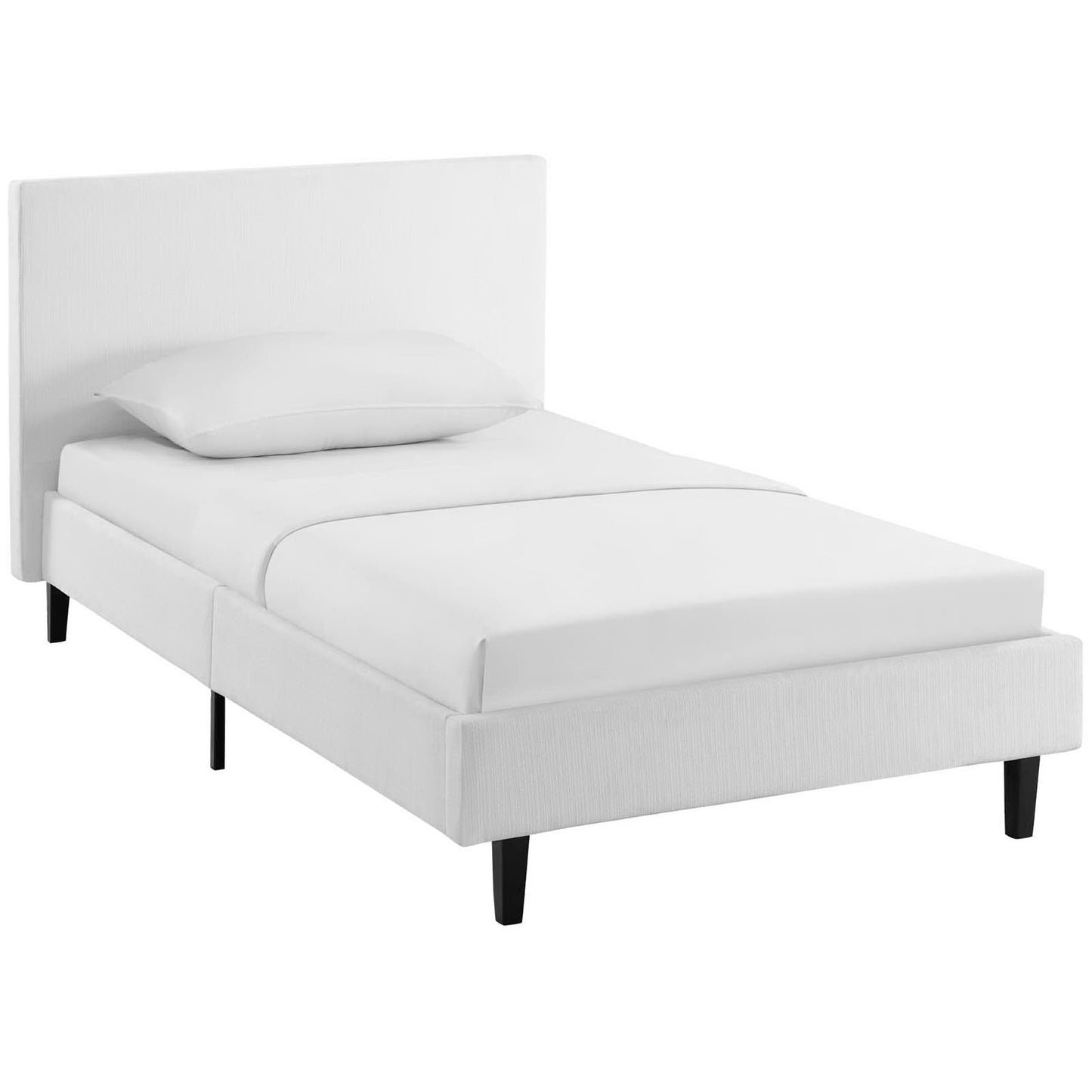 White upholstered platform bed with tall padded headboard, black legs, modern minimalist design; twin bed with white bedding.