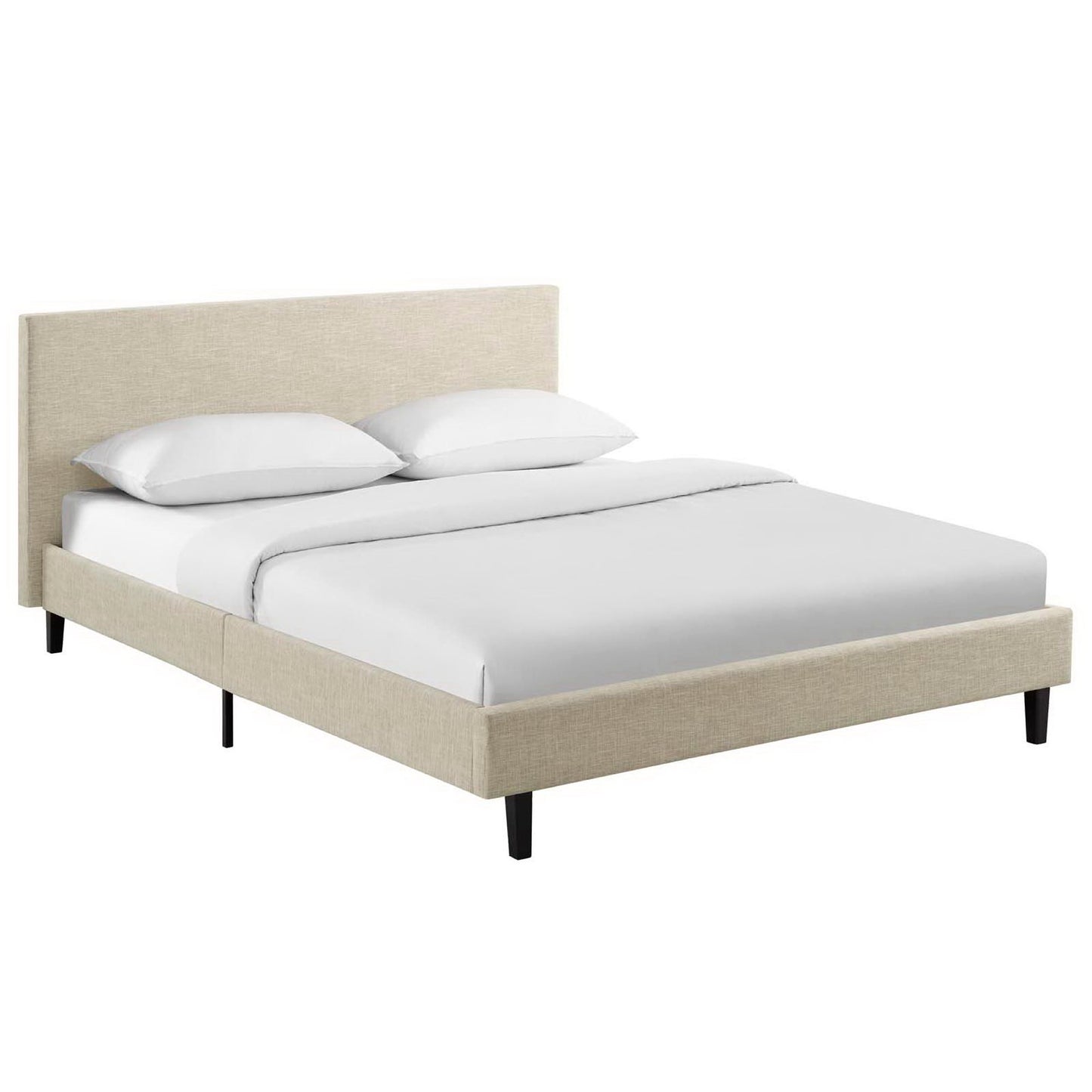 Beige upholstered platform bed with padded headboard, white bedding, and slim black legs.