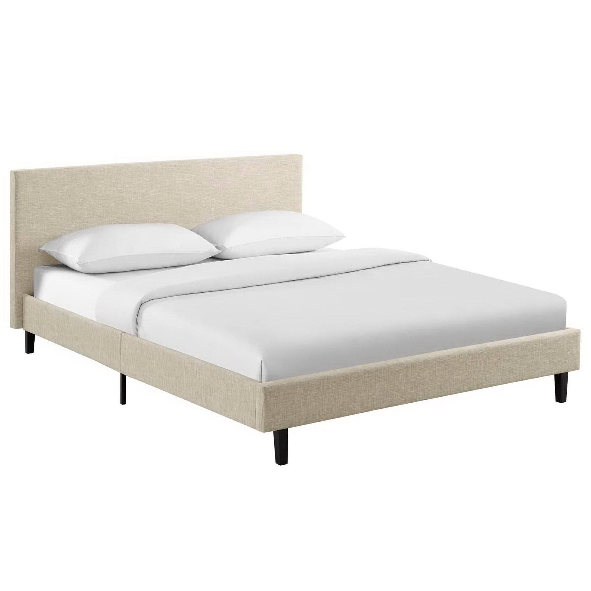 Beige upholstered platform bed with padded headboard, white bedding, and slim black legs.