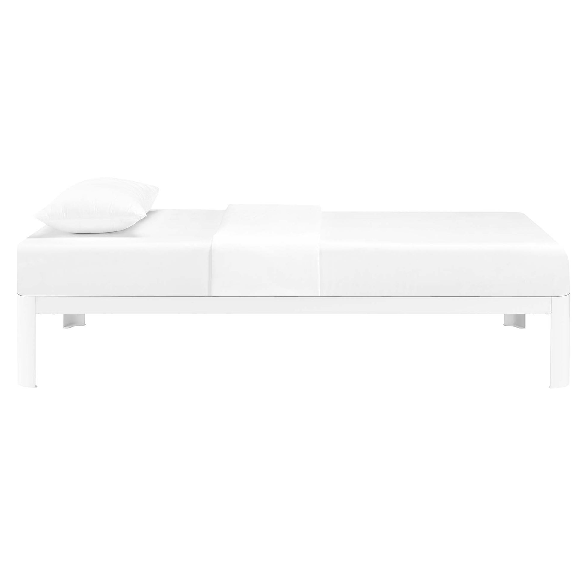 White low-profile platform bed with clean lines, single pillow and folded duvet, modern minimalist bedroom furniture.