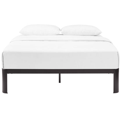 White bedding on a dark brown metal platform bed with two white pillows; minimalist modern design.