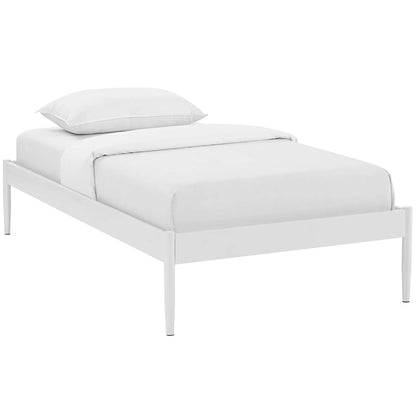White twin bed frame with slim tapered legs and white bedding.