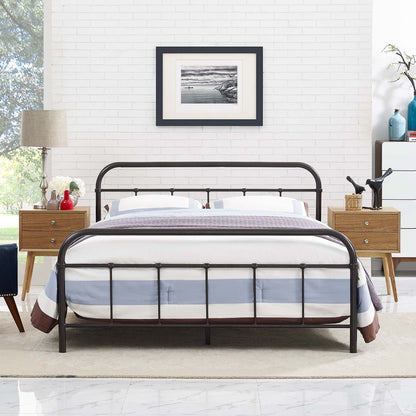 Stainless steel queen bed frame with arched headboard and footboard, blue-gray striped bedding, light wood nightstands, white brick wall.