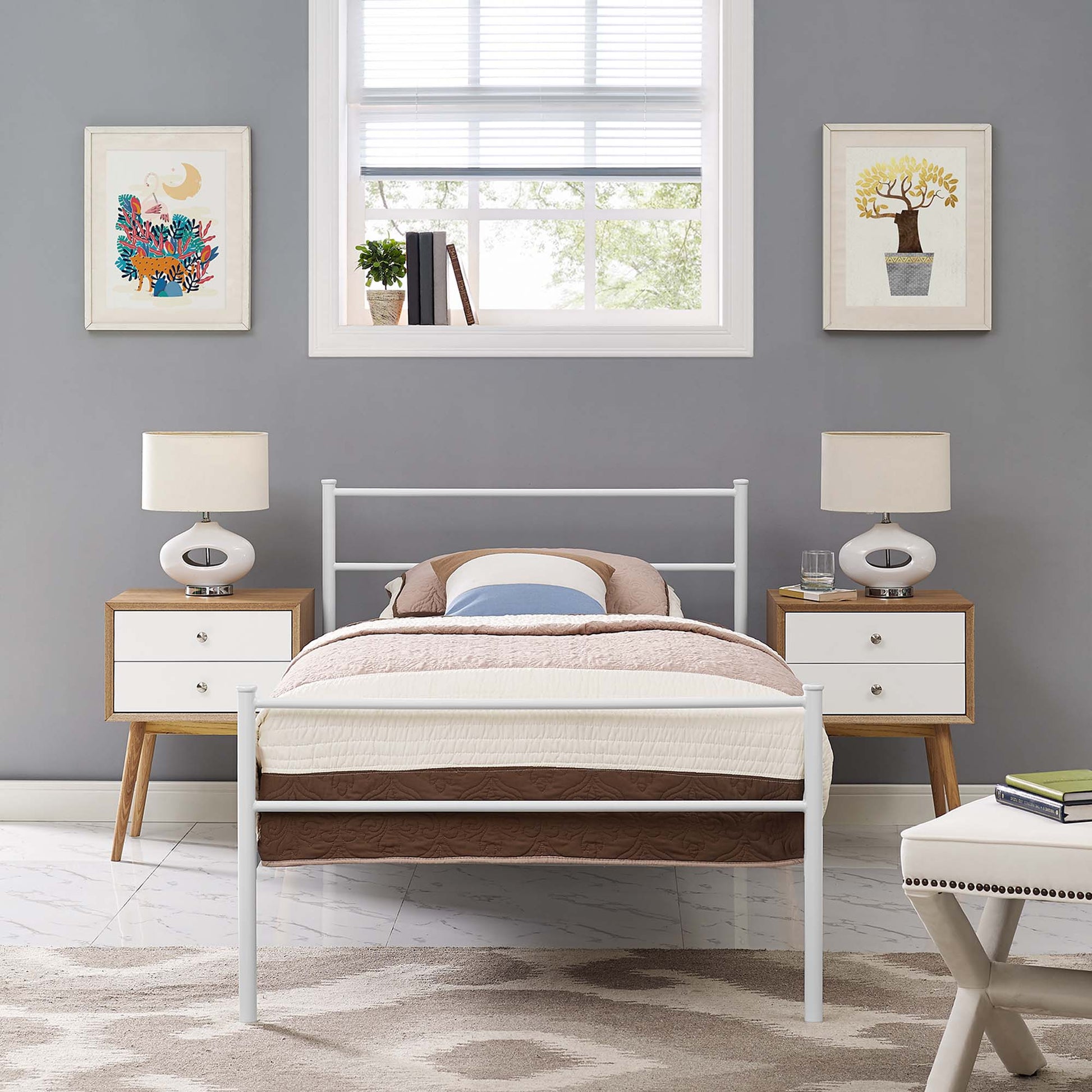 White metal bed frame with beige quilt and brown bed skirt, two wood-and-white drawer nightstands, and matching lamps on gray walls.