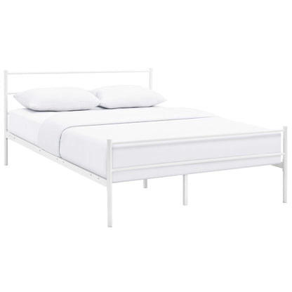 White metal bed frame with headboard and footboard, dressed in white linens and pillows.