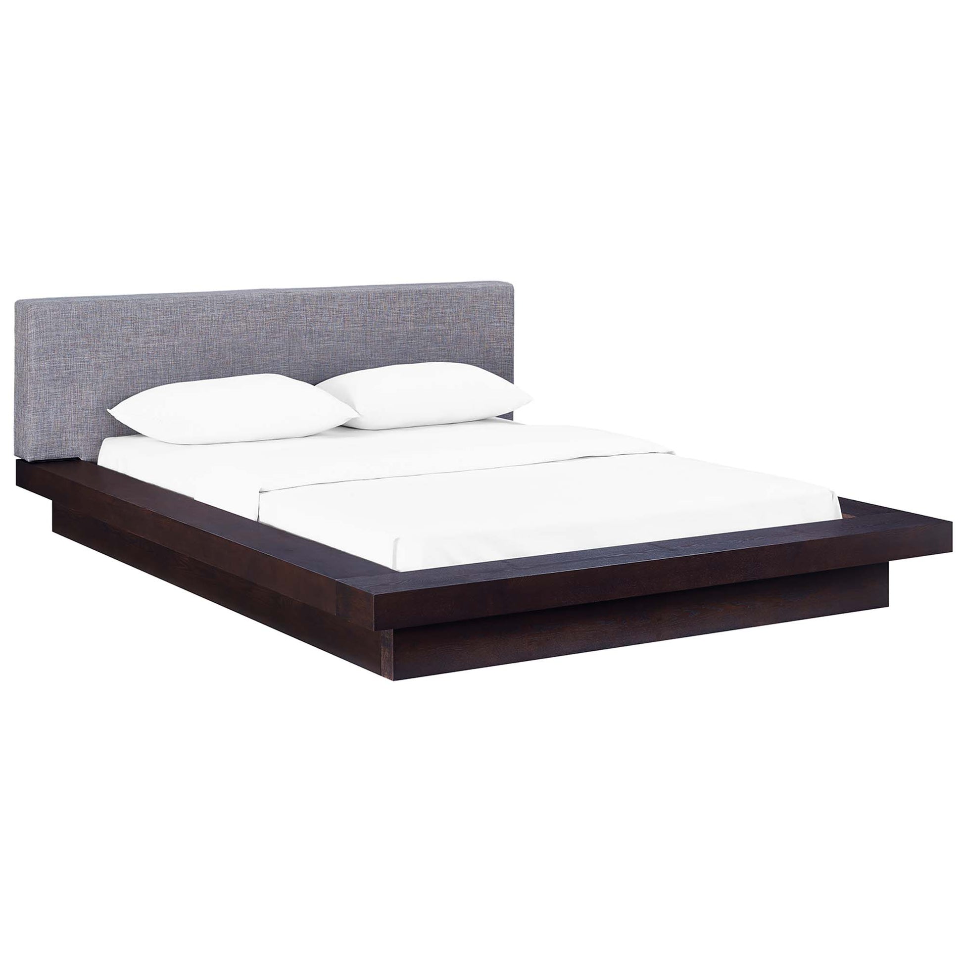 Low platform bed with dark wood frame, gray fabric headboard, and white bedding with two pillows.