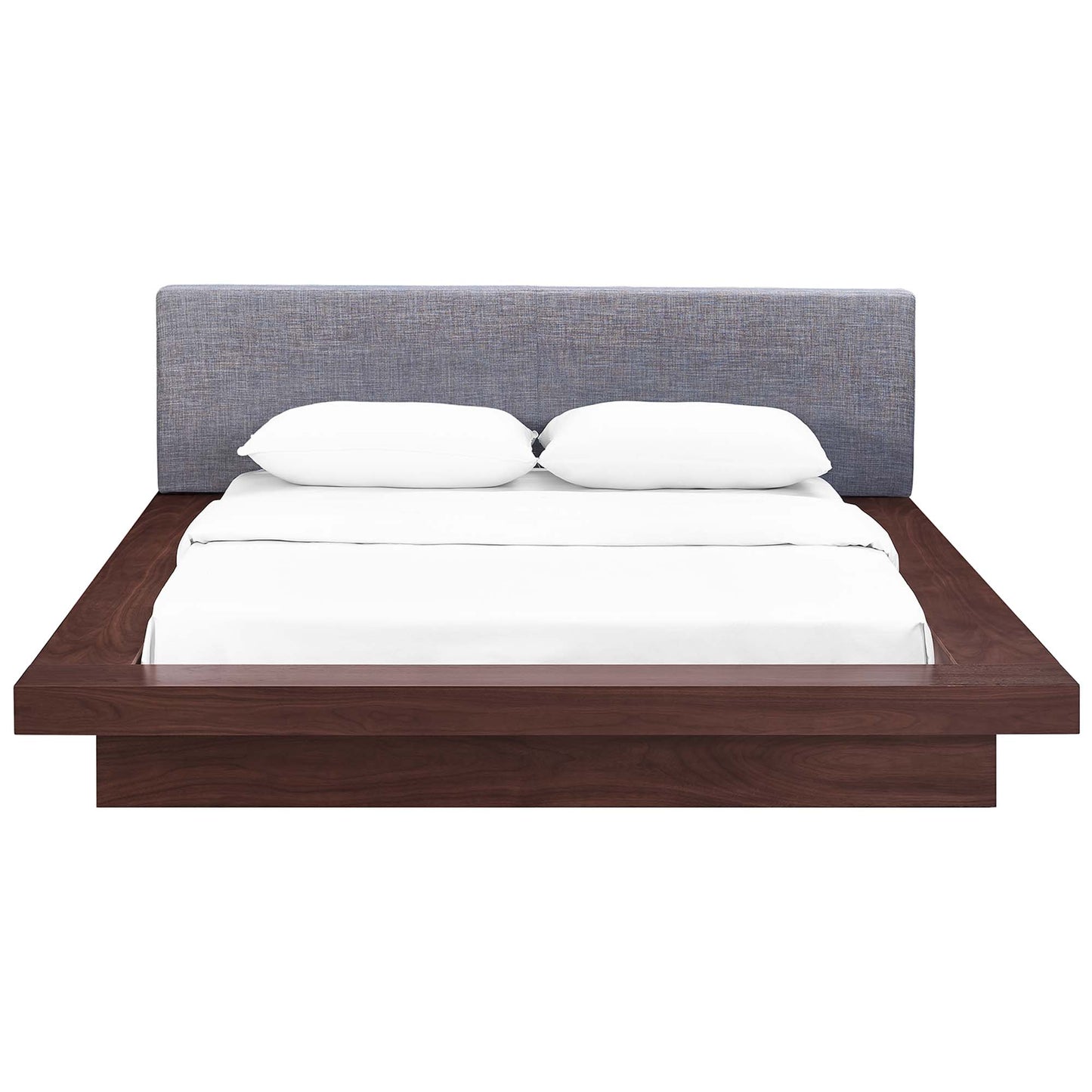 Gray fabric queen platform bed with an upholstered headboard; white bedding & two pillows; contemporary low-profile design.
