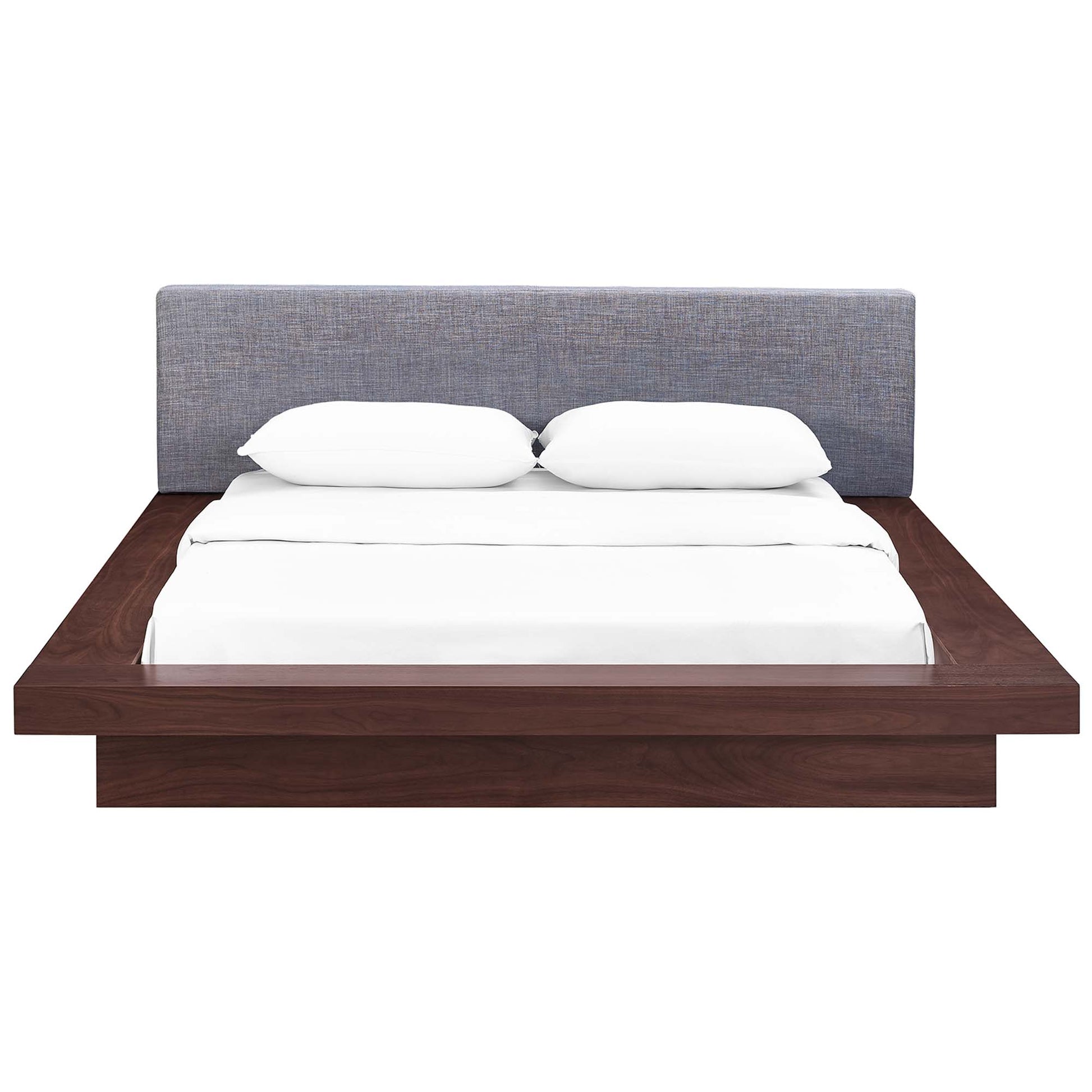 Gray fabric queen platform bed with an upholstered headboard; white bedding & two pillows; contemporary low-profile design.