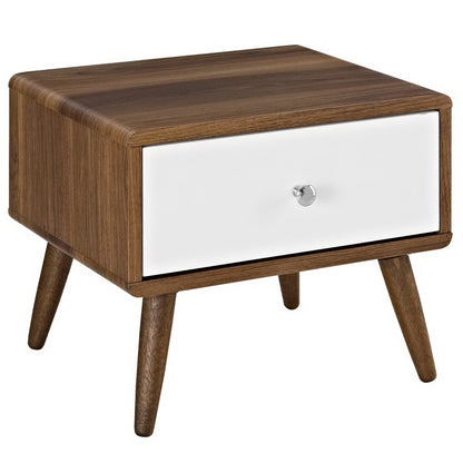 Mid-century walnut nightstand with white front drawer, silver knob, and tapered legs.