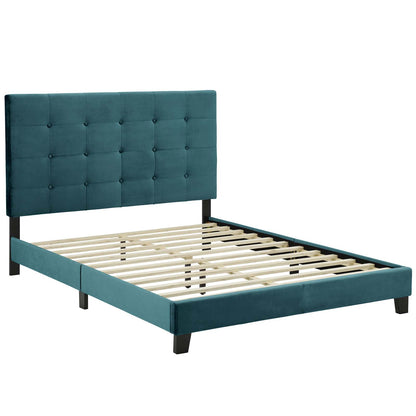 Teal upholstered bed frame with tufted grid headboard, black legs and slatted wooden foundation.